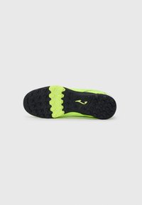 Suela de zapatilla deportiva con un brillante entresuela de color verde neón y una suela exterior de goma negra texturizada con patrones hexagonales para mayor agarre.