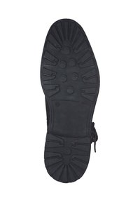 Zwarte rubberen zool met een gestructureerd loopvlakpatroon, met ronde grips en groeven voor grip. Gemarkeerd met maat 42.