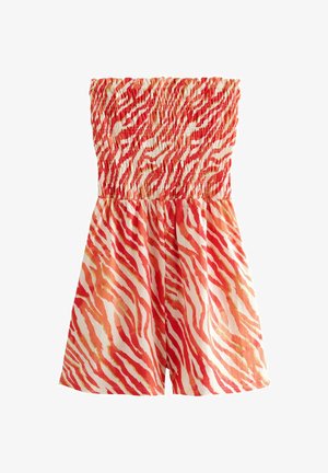 Crveno-bijeli kombinezon bez naramenica s naboranim korzetom i apstraktnim uzorkom tigrovih pruga. Lagani materijal s mekanom teksturom.