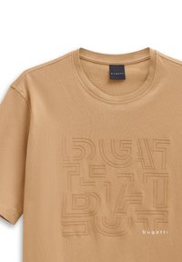 Beige cotton t-shirt with a textured geometric print and the brand name "bugatti" featured in white at the bottom right.