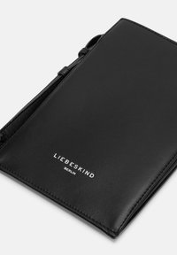 Black leather wallet with a smooth texture, featuring a debossed logo in white. Compact design with a secure closure and slim profile.