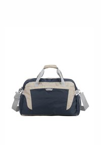 Sac de voyage en toile durable, de couleur marine et beige, doté de doubles poignées supérieures, d'une bandoulière amovible et d'une poche zippée à l'avant.