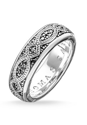 Silver band ring with black bead accents in an intricate interwoven pattern around the entire circumference.