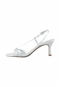 Ezüst színű, pántos designú szandálok, texturált fémes anyagból, nyitott orral és karcsú sarokkal. Állítható bokapánttal.