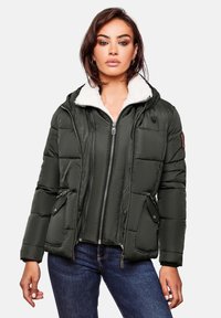 Dark green puffer jacket with a white fleece-lined hood, zippered front, and side pockets. Features quilted texture and leather accents.