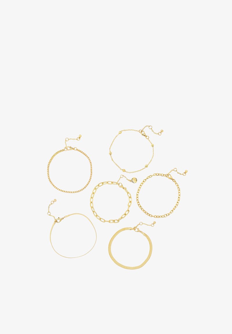 Set of six gold bracelets featuring diverse designs: a beaded chain, a flat band, a link chain, and others, all with adjustable closures.