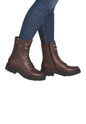 Brown leather ankle boots with a lace-up front, side zipper, and textured sole, featuring metal eyelets and stitching detail.