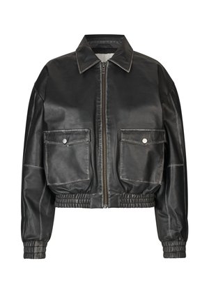 Black leather cropped jacket featuring a front zipper, two large patch pockets, and elasticated cuffs and hem. Smooth texture with contrasting stitching.