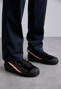 CURLING - Lace-up ankle boots - black