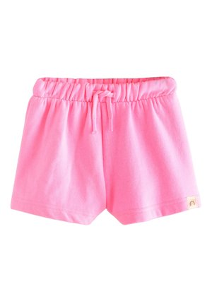 Mäkké ružové krátke nohavice pre batoľatá s elastickým pásom a šnúrkou, malá dúhová nášivka na leme, zobrazené na bielom pozadí.