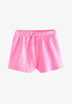 Shorts roses doux pour tout-petits avec taille élastique et cordon, petit patch arc-en-ciel sur l'ourlet, présenté sur fond blanc.