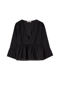 Blusa peplum nera con scollatura a V profonda, maniche a campana lunghe, texture a pois e dettagli in pizzo lungo il décolleté e le maniche.