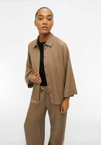 Object Blusa - fossil