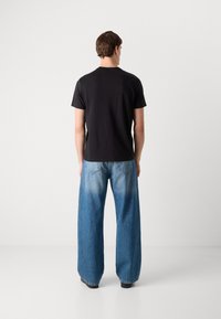Calvin Klein Jeans GRAPHIC TEE - T-shirt print - black