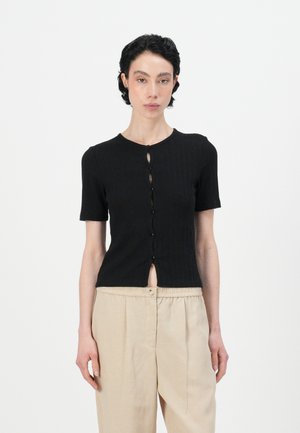Black short-sleeve ribbed top with a round neckline, featuring a row of buttons down the front and a cropped hemline.