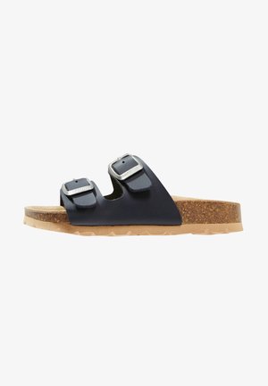Navy blue sandals with two adjustable straps and silver buckles. Cork footbed and beige rubber outsole with textured grip.