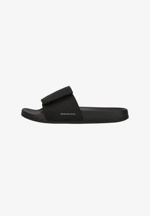 Black slide sandal with a velcro strap, flat sole, textured materials, and "ENDURANCE" logo featured on the side.