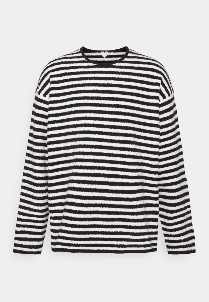 Musta-valkoisessa raidallisessa pitkähihnaisessa poolo-paidassa on pehmeä, teksturoitu kangas. Pyöreä kaula-aukko ja väljä istuvuus. Vaakasuorat raidat vaihtelevat leveydeltään.