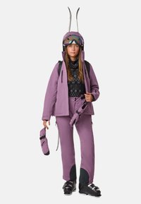 Ski gear set in light purple, consisting of a jacket and pants, with a patterned black top. Includes gloves and a helmet with visor.