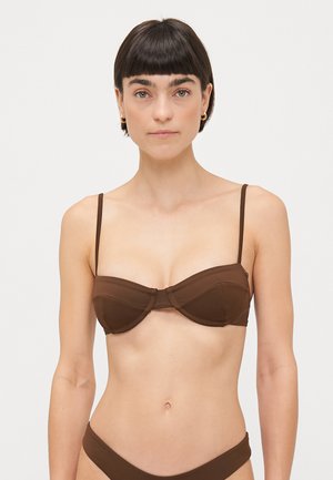 Brown bikini top with underwire support, featuring thin adjustable straps, a molded cup design, and a smooth, matte texture.