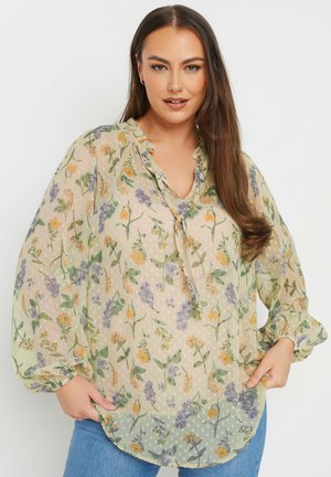 Leichte, durchsichtige Bluse in sanftem Grün mit floralen Mustern in Lila, Orange und Gelb. Mit Rüschenausschnitt und elastischen Ärmeln.