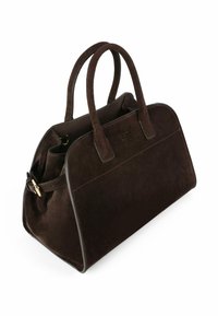 Bruine suède handtas met dubbele handvatten, een ritssluiting en een gladleren rand. Heeft een gestikt detail op het voorpaneel.