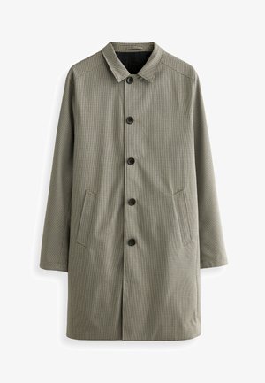 Abrigo de cuadros en tonos verdes apagados y negros. Cuenta con cuello, botones delanteros y bolsillos laterales. Está hecho de una tela lisa.