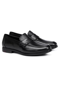 Schwarze Leder Slipper mit glatter Oberfläche, die ein gesticktes Band über die Vorderseite und eine flache Gummisohle aufweisen.