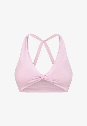 Roze naadloze bralette met een diepe halslijn, gedraaide voorkant en gekruiste rugbandjes. Glad textuur en gemiddelde dekking.