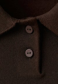 Dark brown knitted sweater collar with two round, dark buttons fastened on a ribbed fabric placket.
