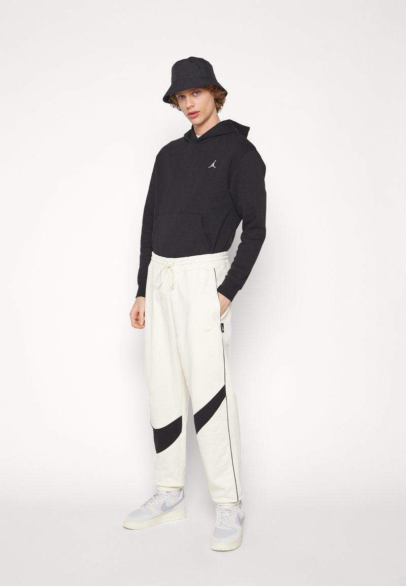 nike track pants big swoosh