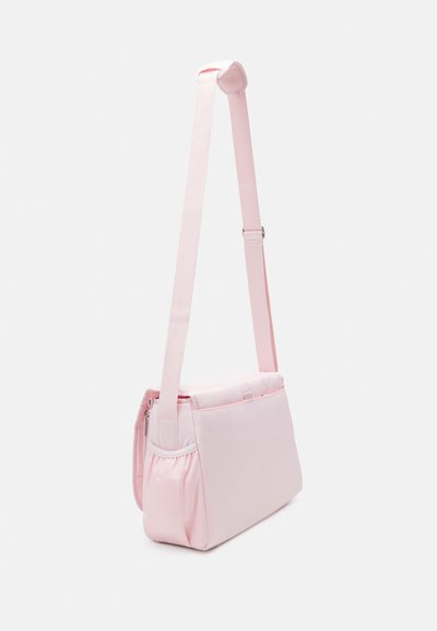 Pink shoulder bag with a rectangular shape, made of soft material. Features adjustable strap, zip closure, and pleated side detail.