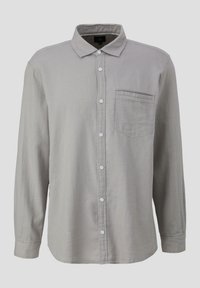 Lichtgrijze langemouwen blouse gemaakt van gestructureerde stof. Heeft een puntige kraag en een enkele borstzak. Witte knopen.