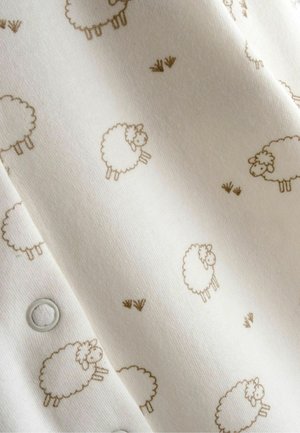 Valge kangas, millel korduv helepruun lambamuster, tekstuuriga ja pehme, ühe serva äärde paigaldatud klõpskinnitustega.