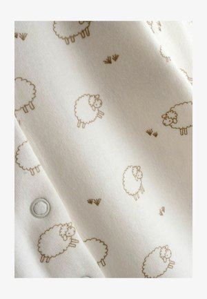 Valkoinen kangas, jossa toistuva vaaleanruskea lampaan kuvio, teksturoitu ja pehmeä, ja jossa näkyy painonapit toisella reunalla.