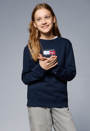 Navyblauwe sweatshirt van een katoenmix, met een grafisch logo in rood, wit en blauw. Geribde manchetten en zoom, in een relaxte pasvorm.