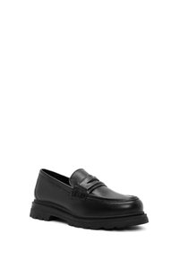 Mocassins en cuir noir à bout rond, dotés d'une sangle décorative et d'une semelle épaisse en caoutchouc avec des rainures pour une meilleure adhérence.