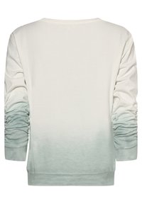 Sudadera ligera de color crema con mangas largas, con una transición gradual de ómbre a un verde suave en los puños y el dobladillo. Textura de algodón suave.