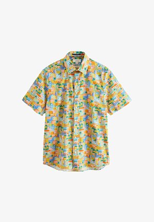 Short-sleeve button-up shirt with colorful abstract cityscape pattern in yellow, blue, green, and orange tones on white background.