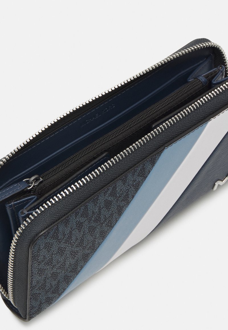 Michael Kors TECH ZIP AROUND UNISEX Wallet blue denim Zalando.ie