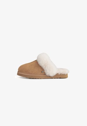 Brown suede slipper with a white faux fur collar, rounded shape, rubber sole, and subtle logo detail on the side.
