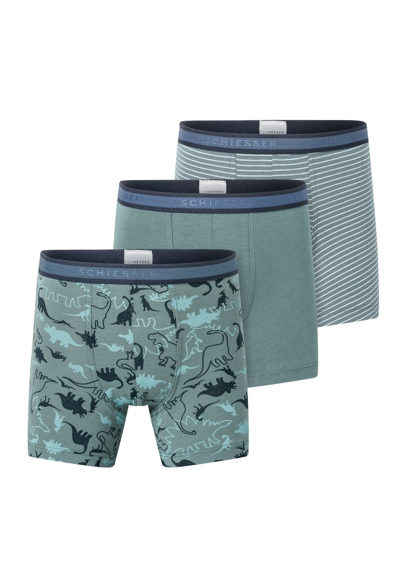 Three pairs of men's boxers in various designs: one with dinosaur print, one solid green, and one blue striped, all featuring elastic waistbands.
