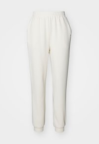 Witte, taps toelopende sweatpants van zachte stof met een elastische tailleband en manchetankels. Voorzien van zijzakken voor extra gemak.