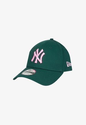 Green baseball cap with a pink embroidered NY logo on the front, solid design, curved visor, and adjustable back strap.