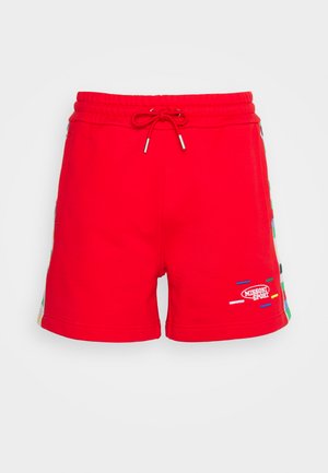 Κόκκινες αθλητικές βερμούδες με ελαστική μέση και κορδόνι, με πολύχρωμα μοτίβα στις πλευρές και λεπτομέρεια λογότυπου κεντημένη.
