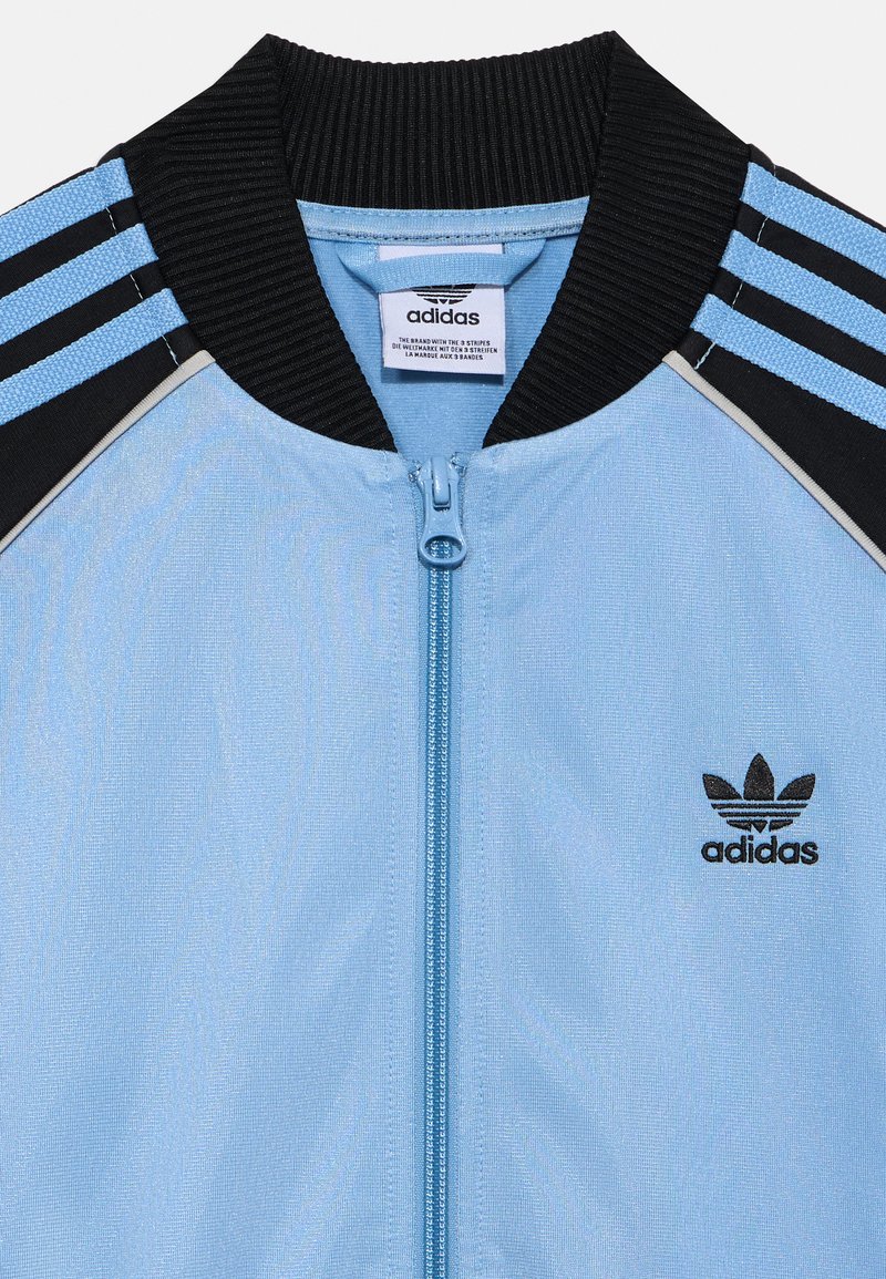 adidas gazelle silver green womens SST Track Top in Ash Blue/White | adidas Originals