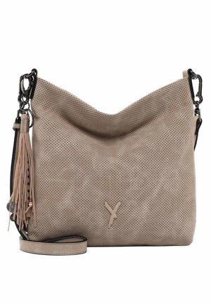 Beige perforated suede shoulder bag with black metal clasps, decorative tassel, and adjustable strap laying flat on white background.