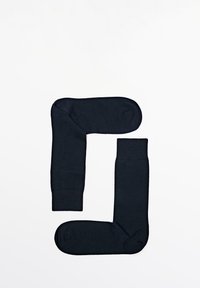 Dunkelblaue Socken, aus weichem Material, gefaltet, um eine 'G'-Form zu bilden. Merkmale sind eine abgerundete Zehenpartie und ein flexibler Bund.