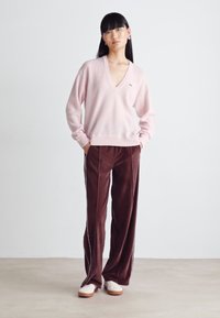 Lacoste Pantalon de survêtement - expresso/white