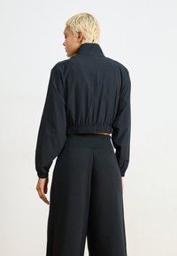 Nike Sportswear STREET - Casaco de treino - black